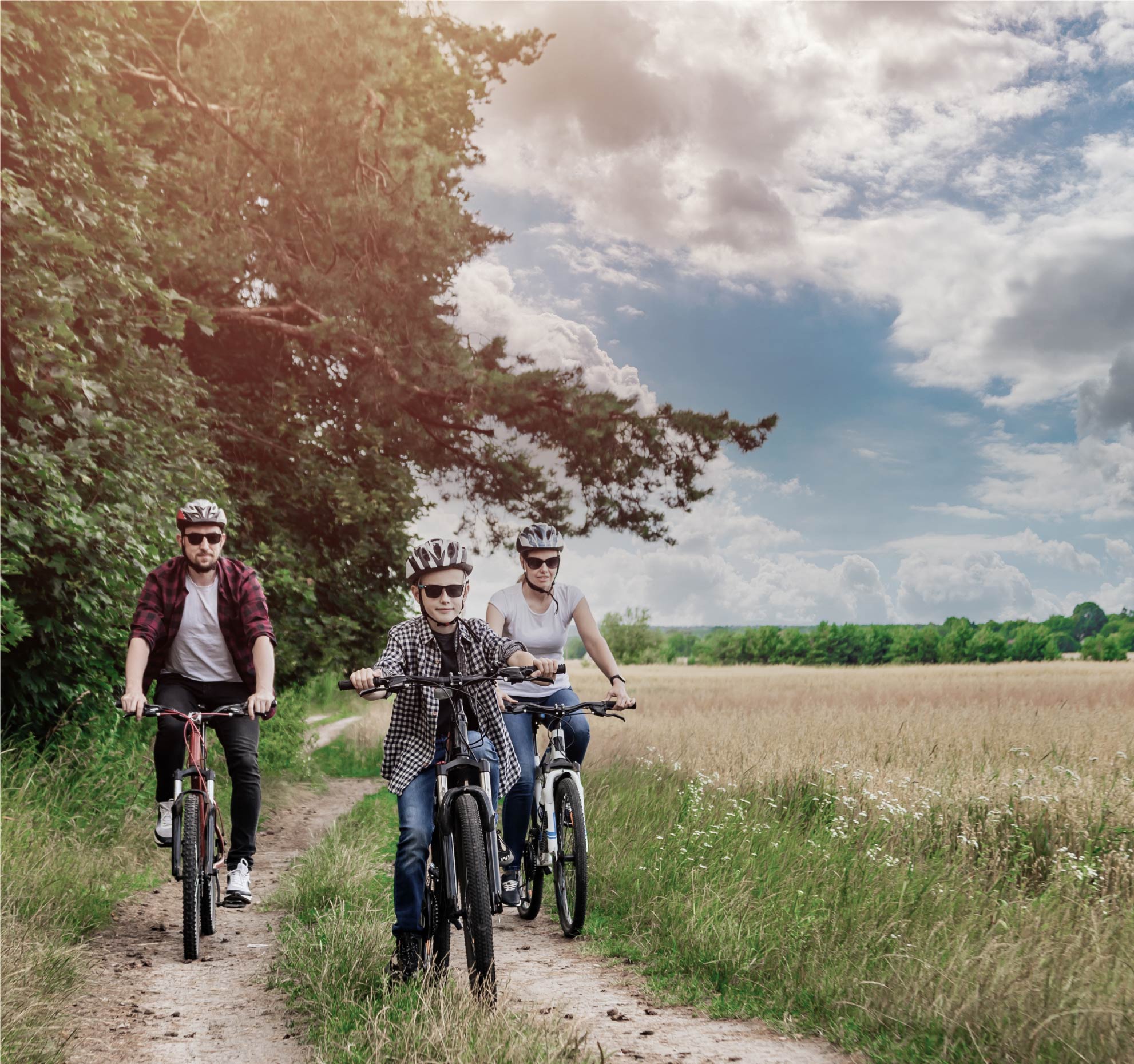 A family cycling on a countryside trail